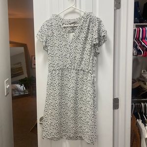 H&M mid length white dress with black floral detail. Perfect for the office!